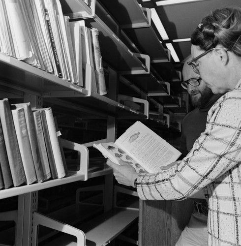 Elizabeth Shor and librarian William J. Goff in the Hubbs Library, Marine Biology Building, preparing for its move to the Eckart Building