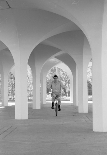 Paul D. Saltman riding bicycle, Revelle College, UC San Diego