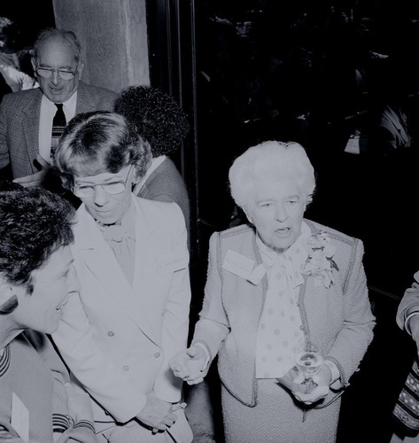 Ellen Virginia (Clark) Revelle (right) and Rita Atkinson (left) with William A. Nierenberg in background, Ellen Browning Scripps Memorial Pier rededication ceremony, Scripps Institution of Oceanography