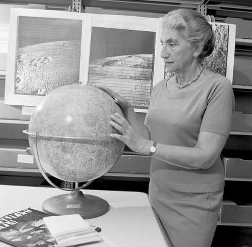 Gertrude Weiss Szilard with lunar maps and moon globe, UC San Diego