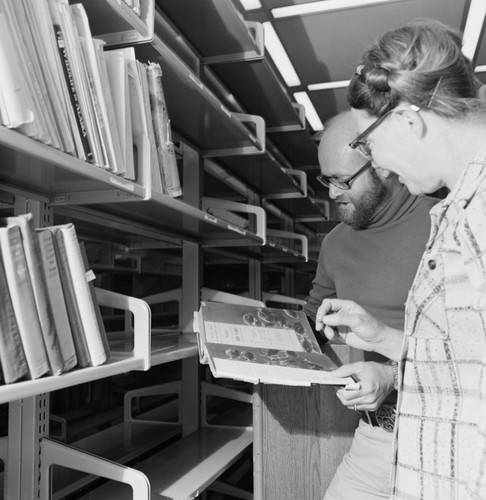 Elizabeth Shor and librarian William J. Goff in the Hubbs Library, Marine Biology Building, preparing for its move to the Eckart Building