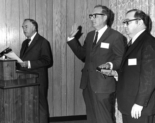 William A. Nierenberg being swore in as chairman of the National Advisory Committee on Oceans and Atmosphere, with Maurice H. Stans (left) and Robert M. White (right)