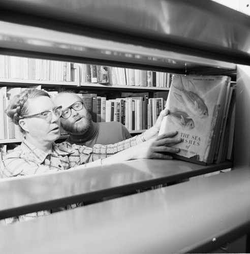 Elizabeth Shor and librarian William J. Goff in the Hubbs Library, Marine Biology Building, preparing for its move to the Eckart Building