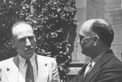 Carl Eckart (left) with G.E.M. Jauncey at the Cosmic Ray Symposium in Chicago, Illinois