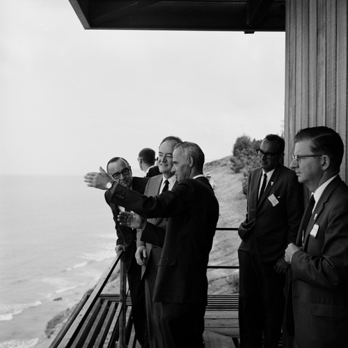 Vice President Hubert Horatio Humphrey visits the Scripps Institution of Oceanography campus, looking up the coastline from the Institute of Geophysics and Planetary Physics (IGPP) building balcony