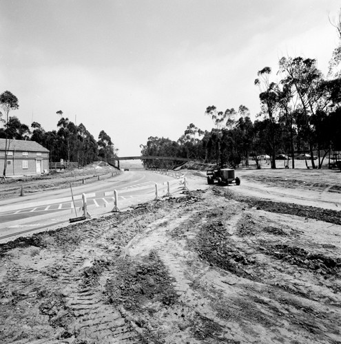 Construction of Gilman Drive on UC San Diego campus, near pedestrian bridge