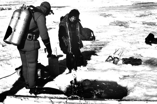 John S. Oliver (left), David A. Kellogg (center), and Peter N. Slattery (diving) near McMurdo Sound, Antarctica