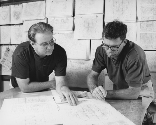 Daniel R. Cayan (right) and unidentified man examining charts