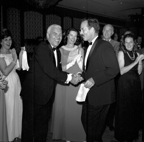 William James McGill (left) shaking hands with George G. Shor (right), UC San Diego