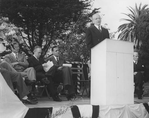 Martin Johnson, Detlev Bronk, Roger Revelle, and Robert Sproul (at podium) at dedication of Thomas Wayland Vaughan Aquarium Museum, Scripps Institution of Oceanography