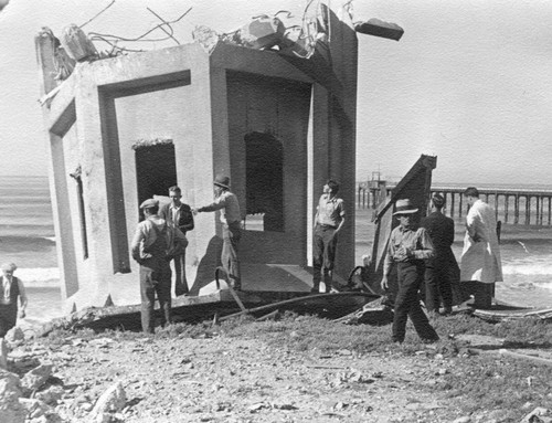 Scientists and construction workers examine the toppled seawater tower, Scripps Institution of Oceanography