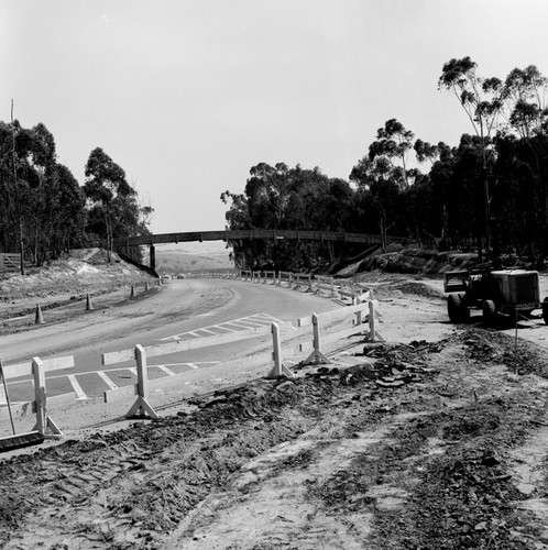 Construction of Gilman Drive on UC San Diego campus, near pedestrian bridge