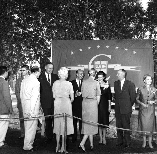 Receiving line at the inauguration of UC President Clark Kerr (center, wearing glasses), with Catherine Kerr (right, center) and Roger Revelle (left, center)