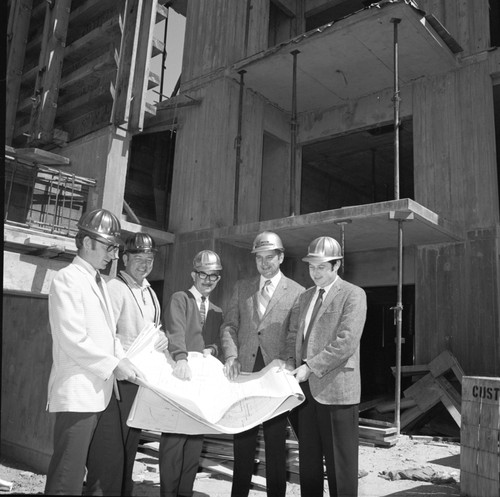 William Loy (architect), Don McCarty (architect), Col. John Carrol (engineer), Steve Koonce (engineer), and unidentified man at construction site