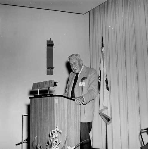 Roger Revelle at podium, Ellen Browning Scripps Memorial Pier rededication ceremony, Scripps Institution of Oceanography