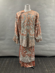 Peach sequined tunic and skirt with crane motif