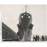 Unusual view of bow of Naval cruiser U.S.S. Oakland moored at Grove Street pier