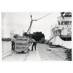 Workers unloading lumber from a schooner at the Ninth Avenue pier