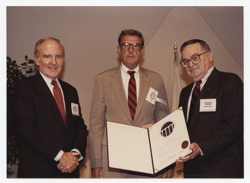 J. Robert Beyster holding certificate from National Academy of Engineering (NAE), with President of NAE Robert White, and Chairman John Welch, Jr