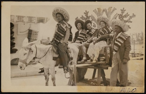 African American tourists on a burro cart in Tijuana, Mexico