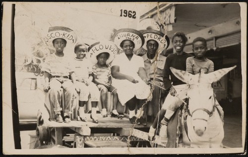 African American family tourists on a burro cart in Tijuana, Mexico