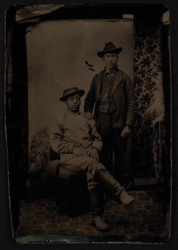 Tintype photograph of two men in western garb