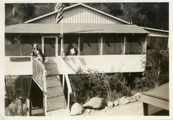 Dorothy Anderson in front of family cabin