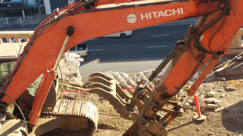 Hitachi excavator at construction site, August 16, 2015