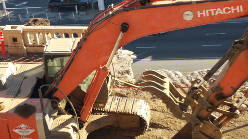 Hitachi excavator at construction site, August 16, 2015