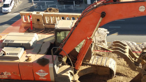 Hitachi excavator at construction site, August 16, 2015