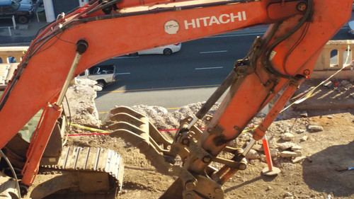 Hitachi excavator at construction site, August 16, 2015