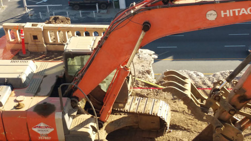 Hitachi excavator at construction site, August 16, 2015