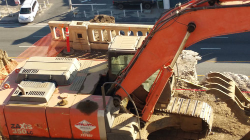 Hitachi excavator at construction site, August 16, 2015