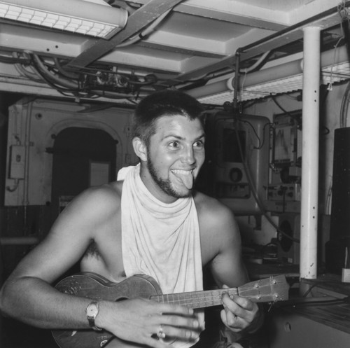 Edward Sheldon Barr plays ukulele aboard R/V Horizon on Leg A of the Capricorn Expedition