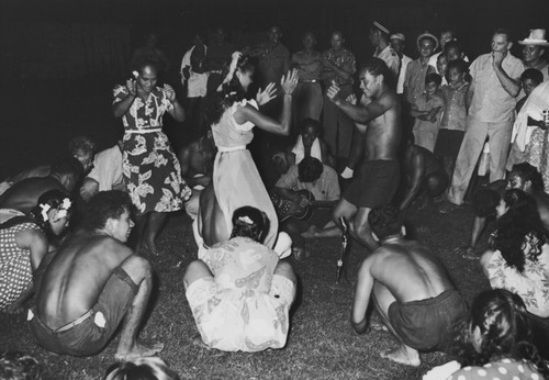 Marquesans at the village of Taiohae perform "Nuku Hiva" dance, with scientific crew from the Capricorn Expedition as audience