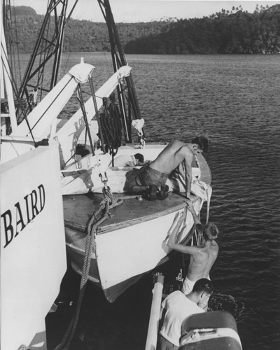 Crew loads items from R/V Spencer F. Baird lifeboat