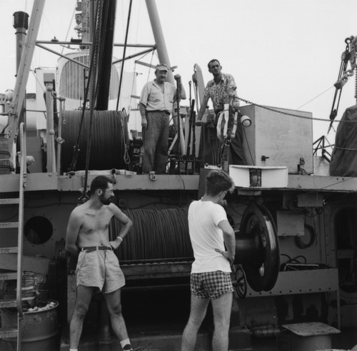 Four men on fantail of R/V Spencer F. Baird