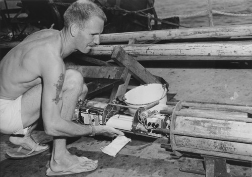 Arthur E. Maxwell examines temperate probe aboard R/V Spencer F. Baird