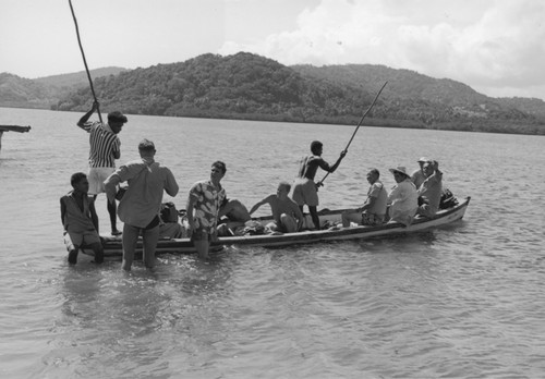 Roger Revelle, Robert Dietz, and Russell W. Raitt on their way back to Viti Levu, after a day of diving with the Fijians on Serua Island