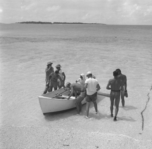 Skiff and crew on beach