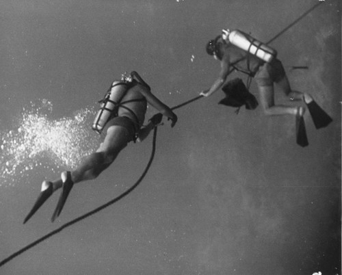 Willard N. Bascom and Robert E. Livingston on tow line beneath a ship during the Capricorn Expedition