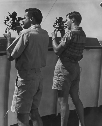 Robert Haines (left) and Robert Livingston (right) use sextants aboard R/V Spencer F. Baird