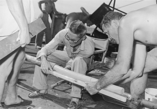 Milton Nunn Bramlette (seated) and Roger Revelle with a drill core