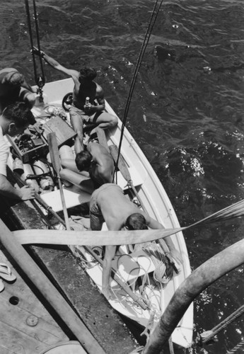 Skiff launched with diving gear and divers, Falcon Island, Tonga