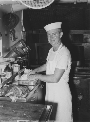 Thomas J. O'Callaghan, the cook on board R/V Horizon, prepares a meal in the ship's galley