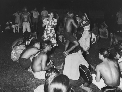 Marquesans at the village of Taiohae perform "Nuku Hiva" dance, with scientific crew from the Capricorn Expedition as audience