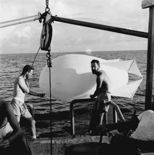 D. T. Hilleary (left) and Sydney Rittenberg (right) prepare to launch a weather balloon