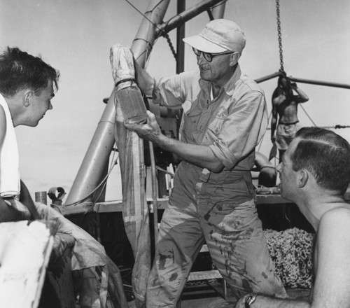 Martin W. Johnson holds a plankton sample, R/V Spencer F. Baird