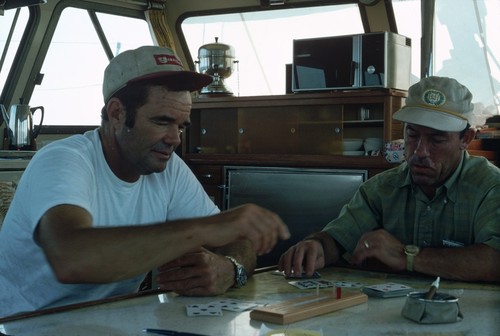 Milton C. Shedd and David M. DeMotte playing cribbage, Sea World Board, albacore fishing trip, about 100 miles south of San Diego, California