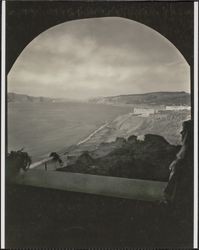 View through an arched window at 768 El Camino del Mar in the Sea Cliff neighborhood of San Francisco, California, 1920s